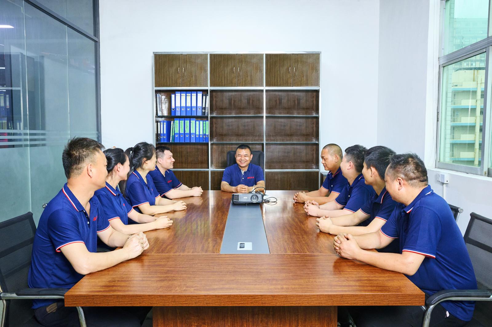 Shenghao team reviewing a project in the meeting room